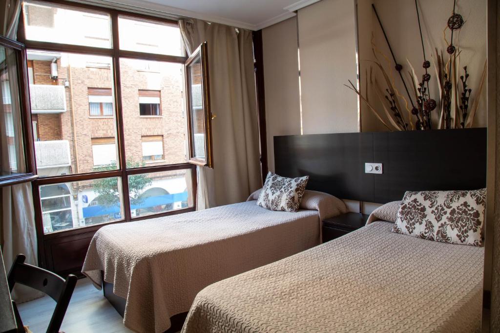 Postel nebo postele na pokoji v ubytování Alojamientos Rooms Catamarán