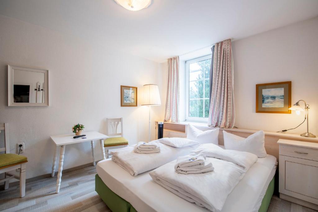 Postel nebo postele na pokoji v ubytování Hotel Villa Sisi