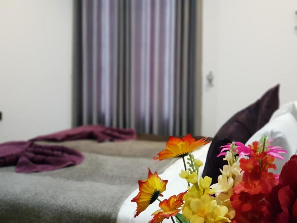 Postel nebo postele na pokoji v ubytování Taj Residence