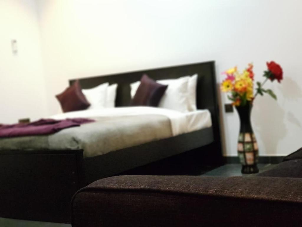 Postel nebo postele na pokoji v ubytování Taj Residence