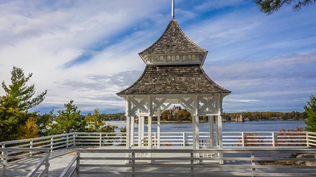 a gazebo on the shore of a lake at Bonnie Castle Resort & Marina in Alexandria Bay