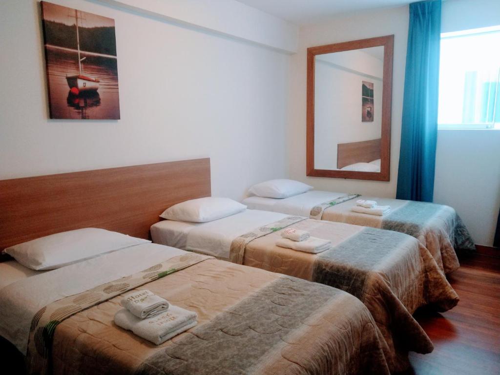 Ένα ή περισσότερα κρεβάτια σε δωμάτιο στο Hotel Paris Lima