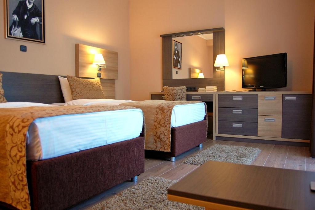Postel nebo postele na pokoji v ubytování Hill Hotel Wellness & Spa