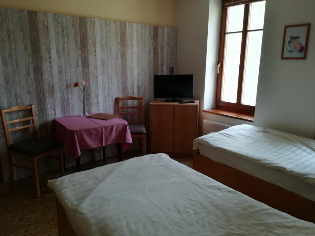 Voodi või voodid majutusasutuse Hotel Kralicek toas