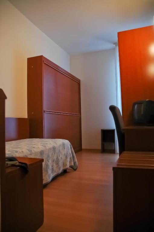 Postel nebo postele na pokoji v ubytování Hotel Santiago