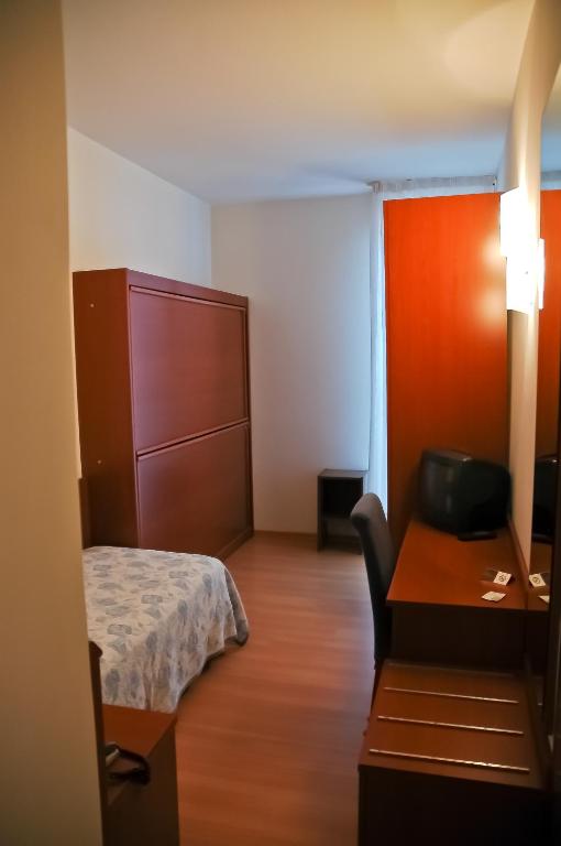 Postel nebo postele na pokoji v ubytování Hotel Santiago