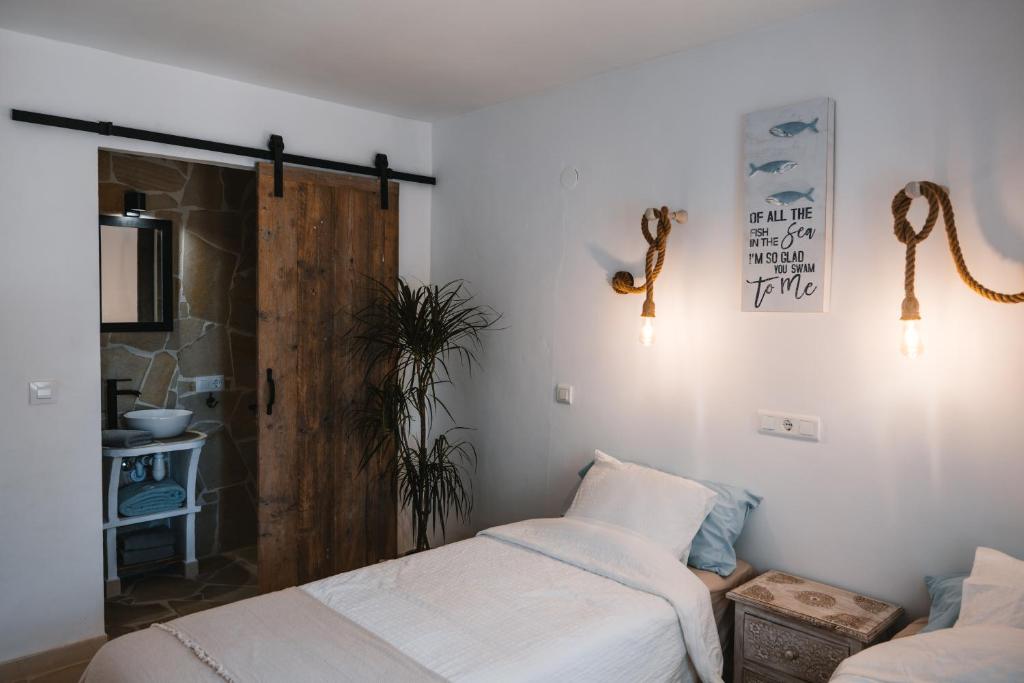 A bed or beds in a room at Villa Boho Ibiza Style