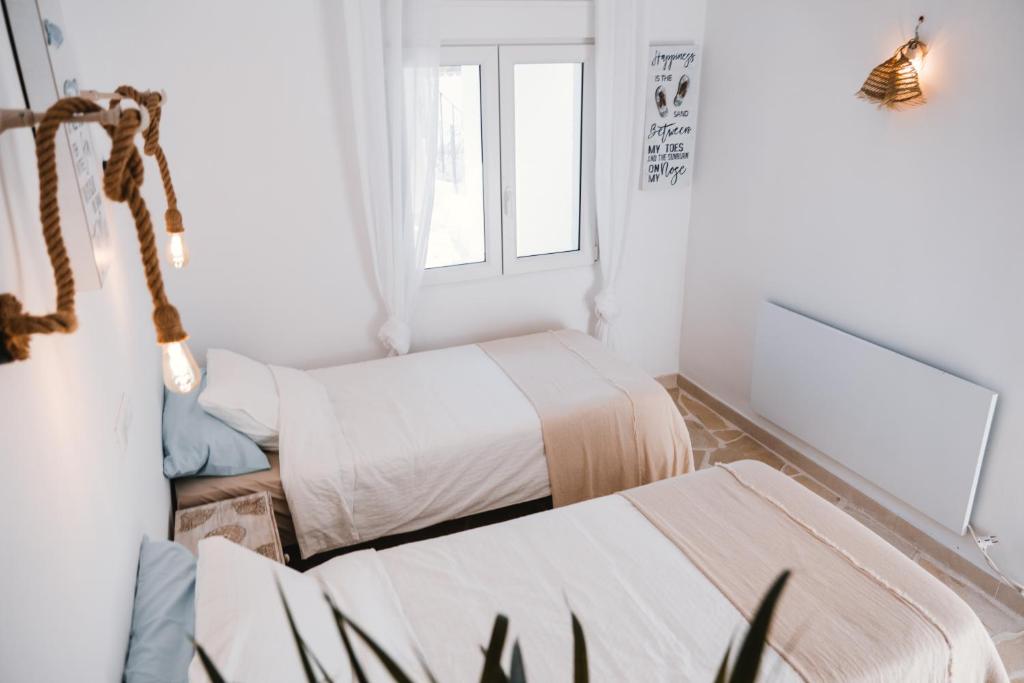 A bed or beds in a room at Villa Boho Ibiza Style