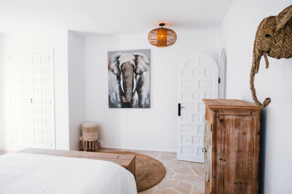 A bed or beds in a room at Villa Boho Ibiza Style