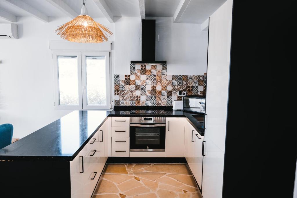 A kitchen or kitchenette at Villa Boho Ibiza Style