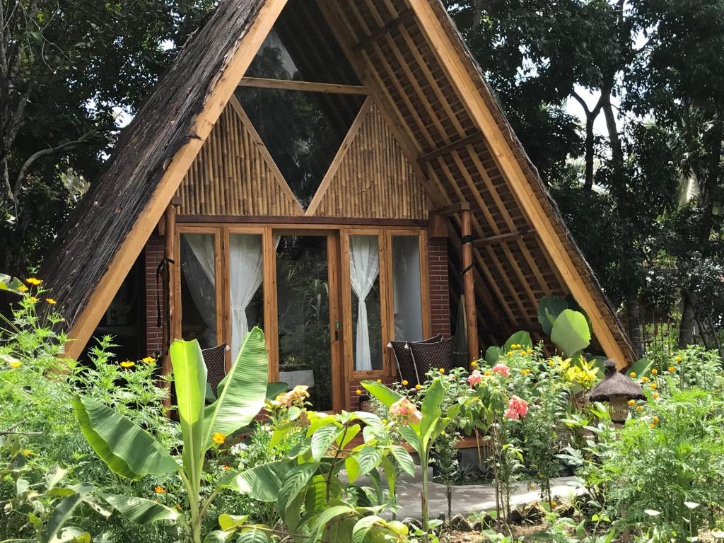 Zahrada ubytování Lagoona Beach Bungalows - Eco Stay