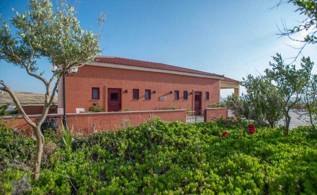 a house with a garden in front of it at Varos Village Boutique Hotel in Város
