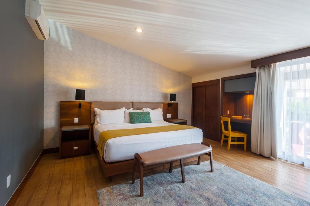 Postel nebo postele na pokoji v ubytování FCH Hotel Expo Adults only
