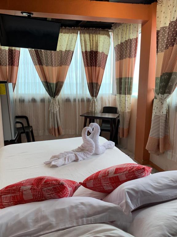 Postel nebo postele na pokoji v ubytování Hotel La Barca