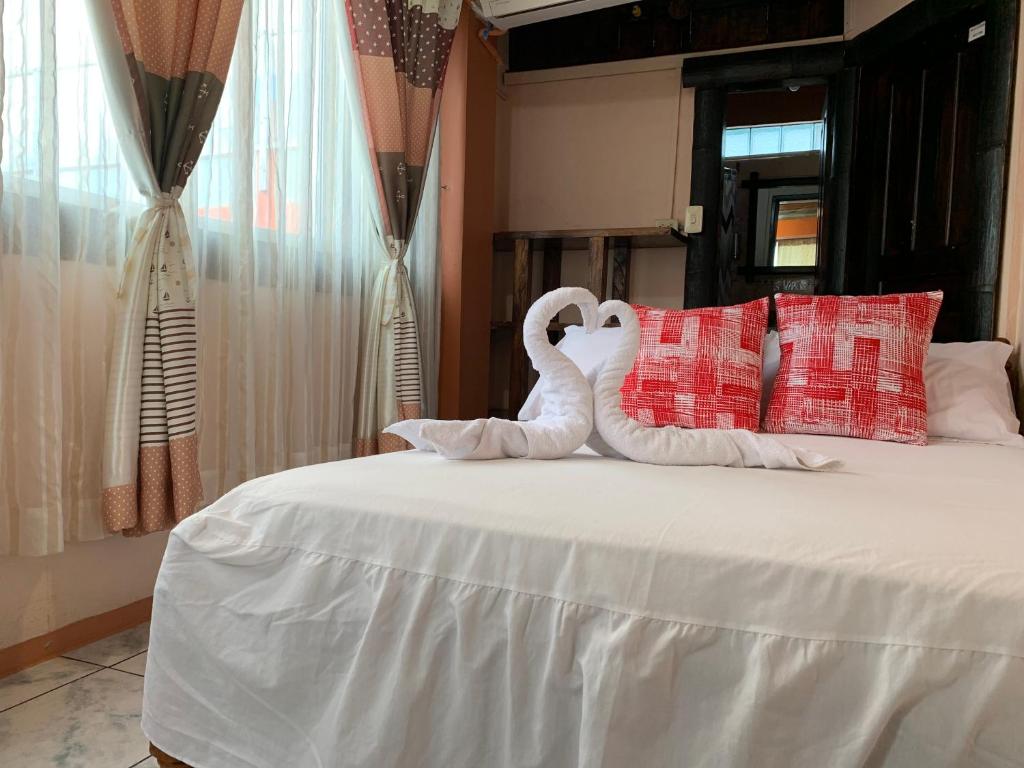 Postel nebo postele na pokoji v ubytování Hotel La Barca
