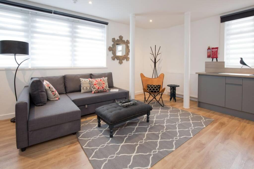 a living room with a couch and a table at Blackbird Luxury Apartments Room 5 in Blackpool