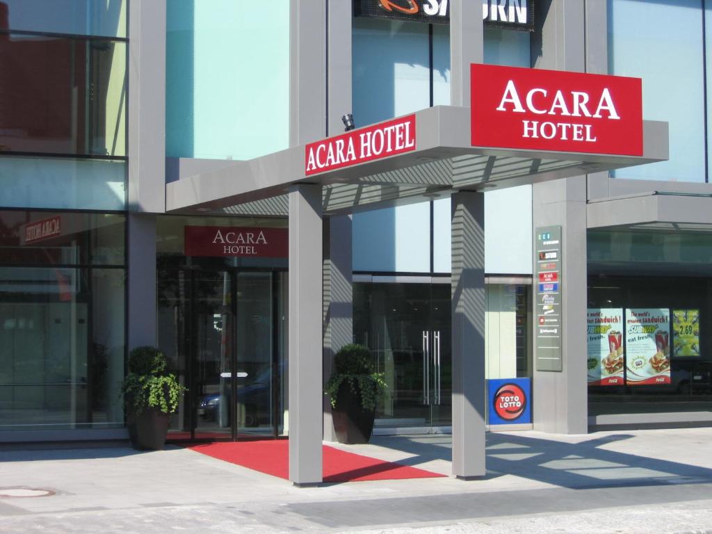 a large building with signs for aaa hotel at AcarA das Penthouse Hotel in Oldenburg