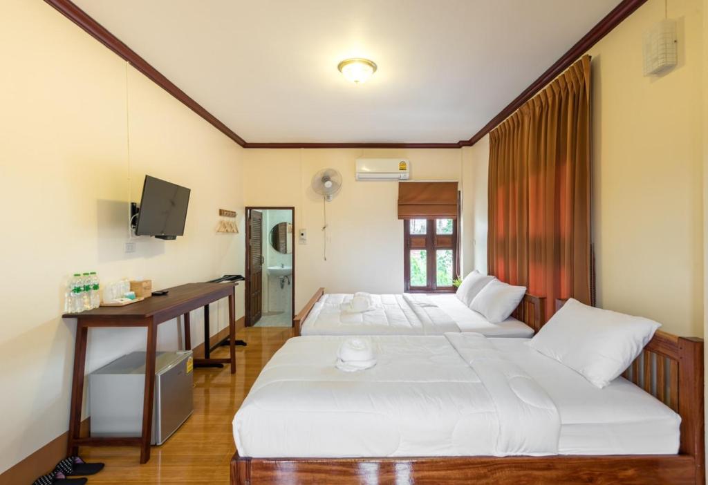 Postel nebo postele na pokoji v ubytování Primmalyn บ้านพริมมาลีณ