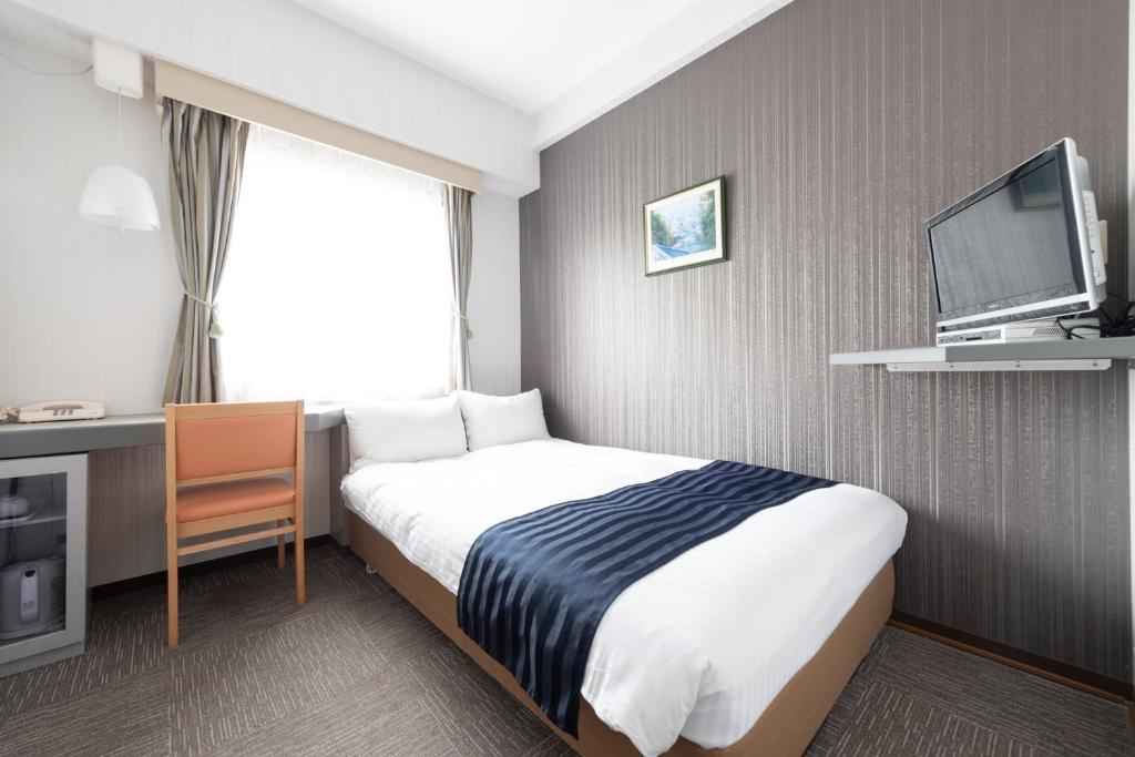 TV a/nebo společenská místnost v ubytování Tottori City Hotel
