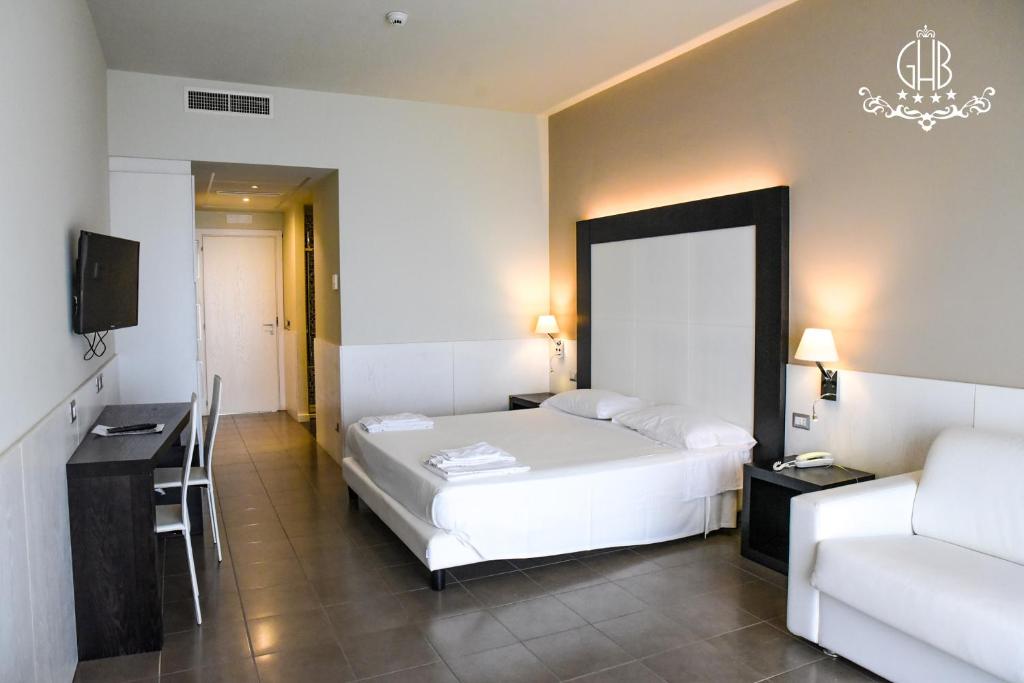 Postel nebo postele na pokoji v ubytování Grand Hotel Balestrieri