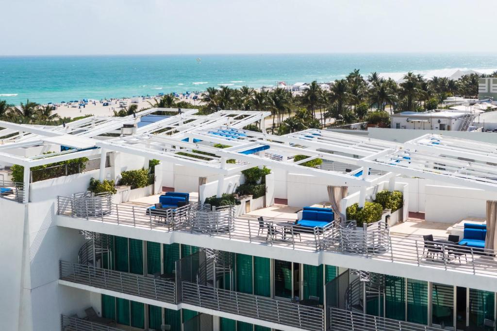 a beach with a lot of palm trees at Z Ocean Hotel South Beach in Miami Beach