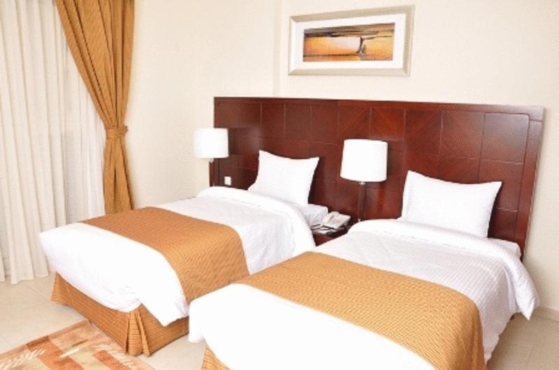 Postel nebo postele na pokoji v ubytování Akas-Inn Hotel Apartment