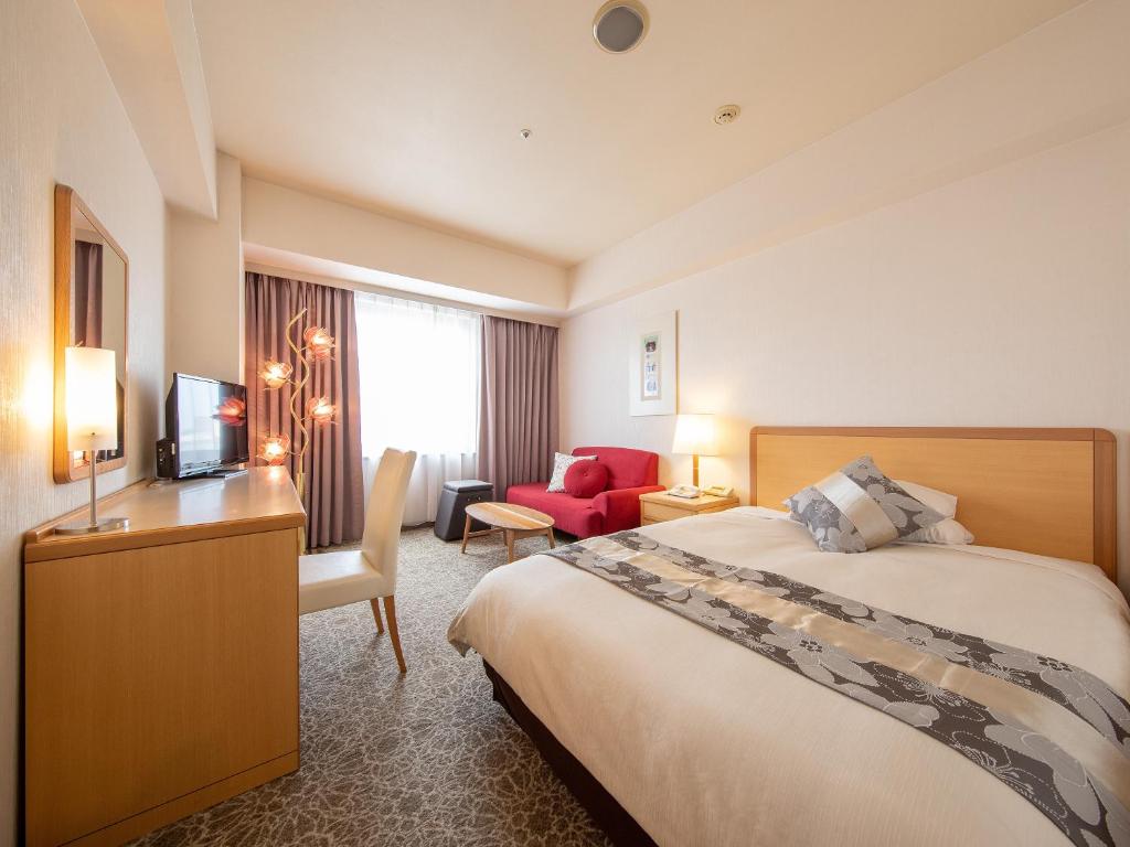 Postel nebo postele na pokoji v ubytování President Hotel Mito