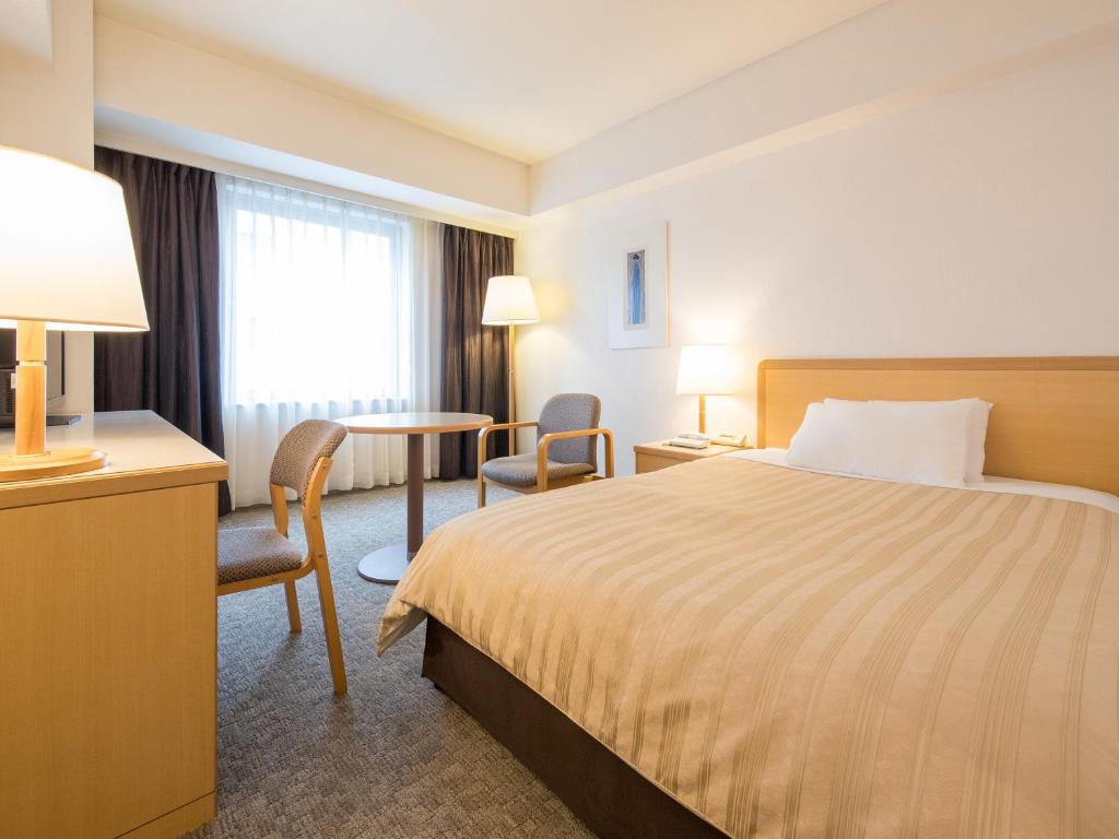 Postel nebo postele na pokoji v ubytování President Hotel Mito