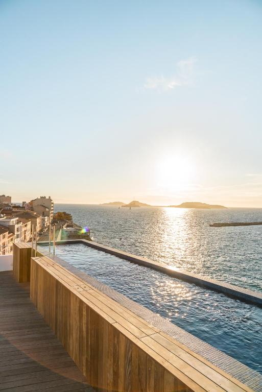 a swimming pool on a pier next to the water at Les Bords De Mer in Marseille