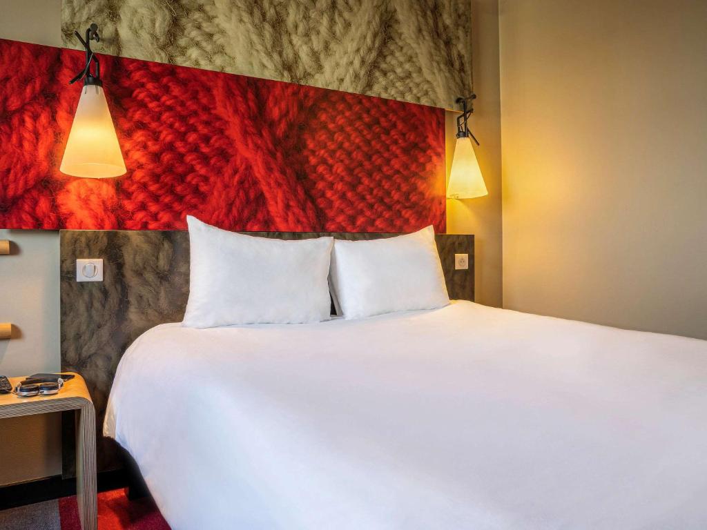 Postel nebo postele na pokoji v ubytování ibis Nanterre La Défense