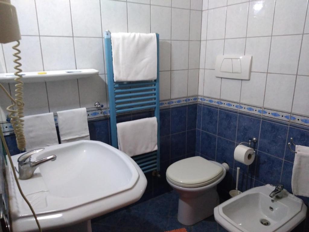 Koupelna v ubytování Hotel Sassacci