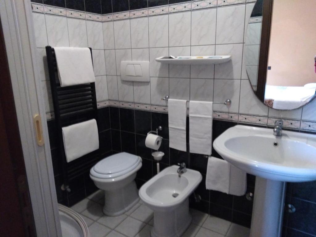 Koupelna v ubytování Hotel Sassacci