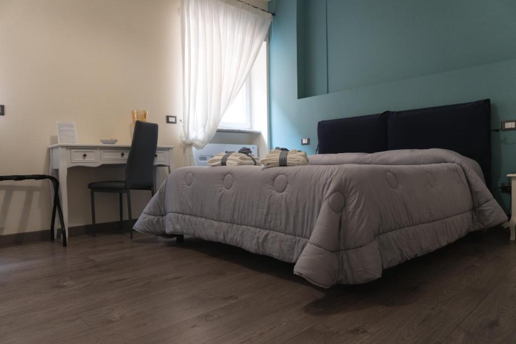 Łóżko lub łóżka w pokoju w obiekcie Maison Gentile