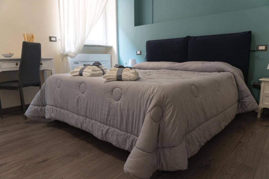 Łóżko lub łóżka w pokoju w obiekcie Maison Gentile