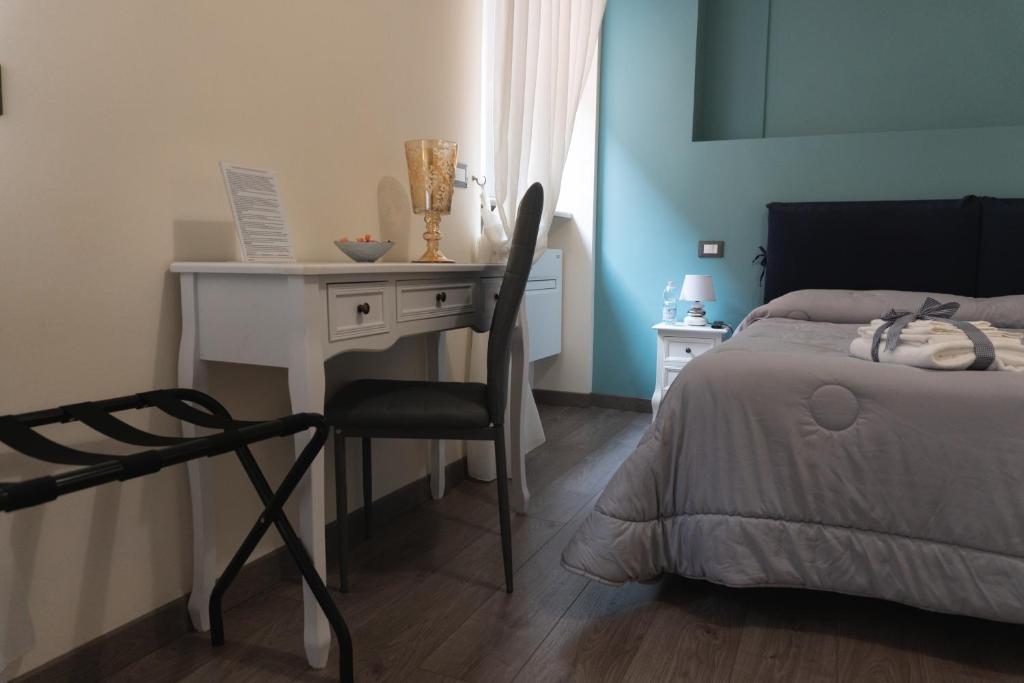 Łóżko lub łóżka w pokoju w obiekcie Maison Gentile
