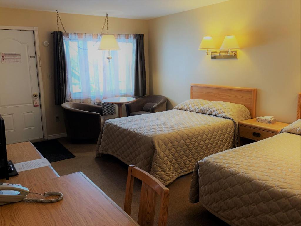 Postel nebo postele na pokoji v ubytování Hawberry Motel