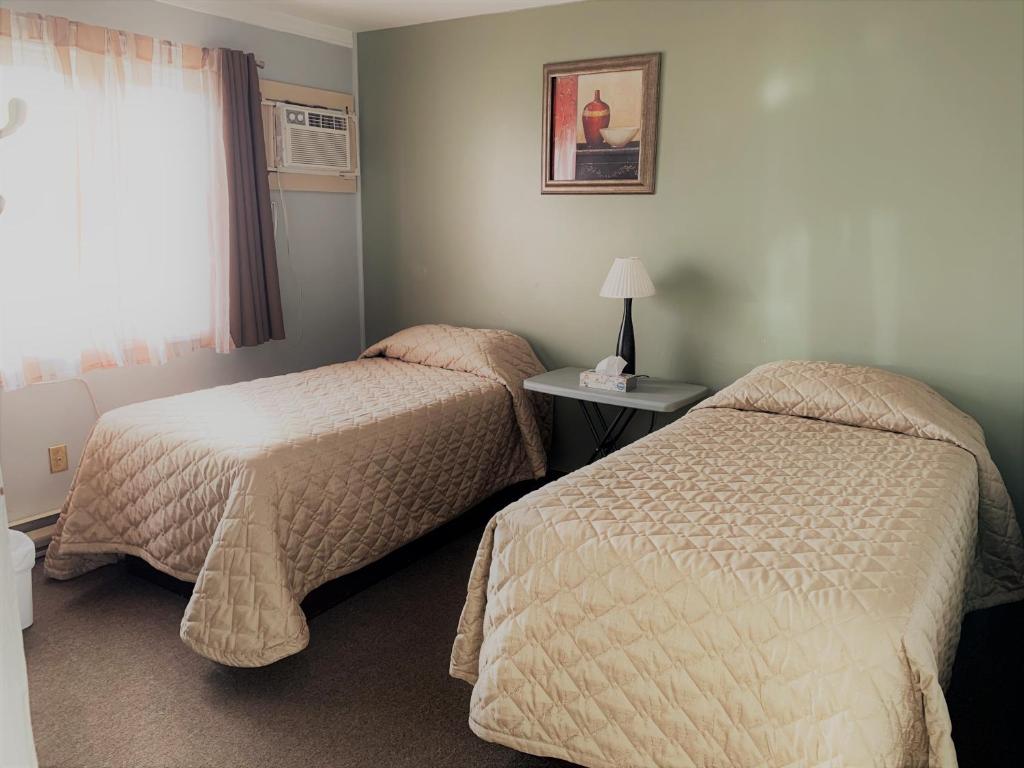Postel nebo postele na pokoji v ubytování Hawberry Motel