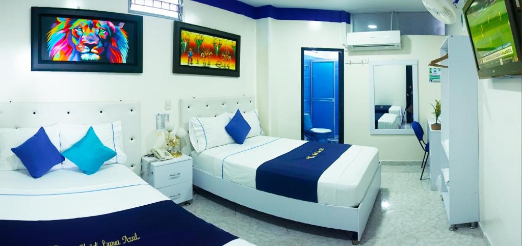 Postel nebo postele na pokoji v ubytování Hotel Luna Azul