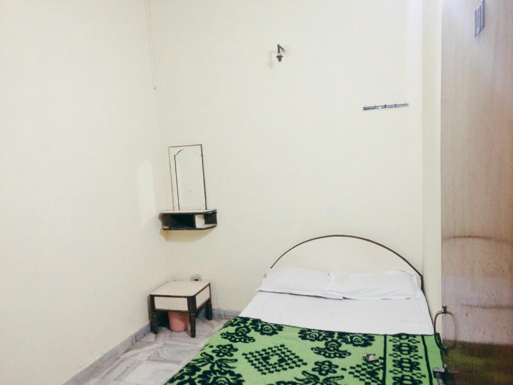 Postel nebo postele na pokoji v ubytování Hotel Marwari