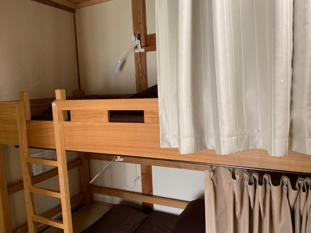 Voodi või voodid majutusasutuse Guest House YAMASHITA-YA toas