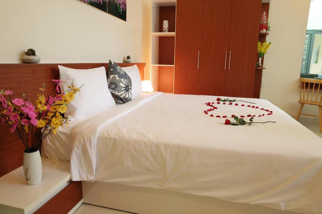 Giường trong phòng chung tại Lam Garden Boutique Homestay