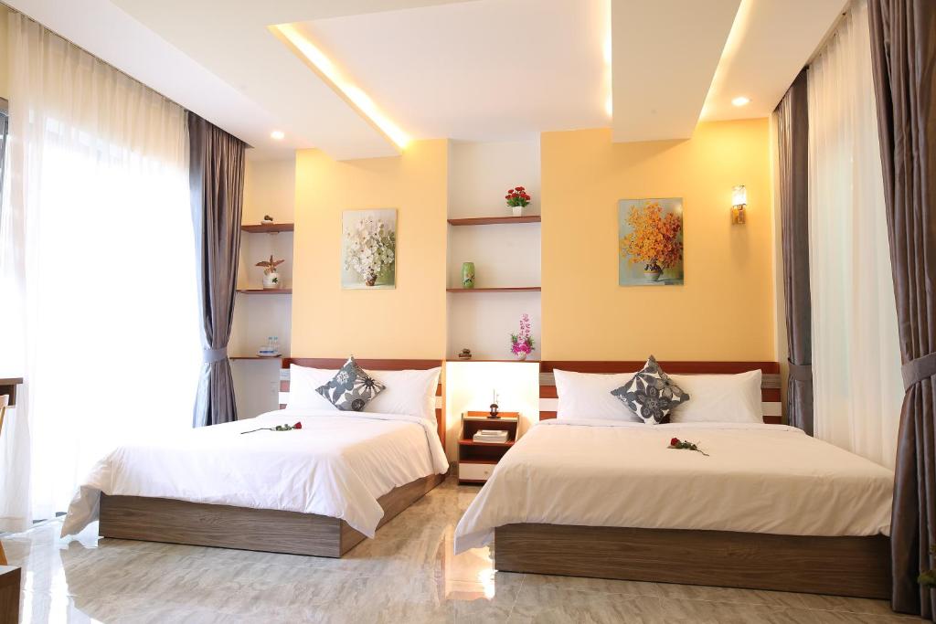 Giường trong phòng chung tại Lam Garden Boutique Homestay