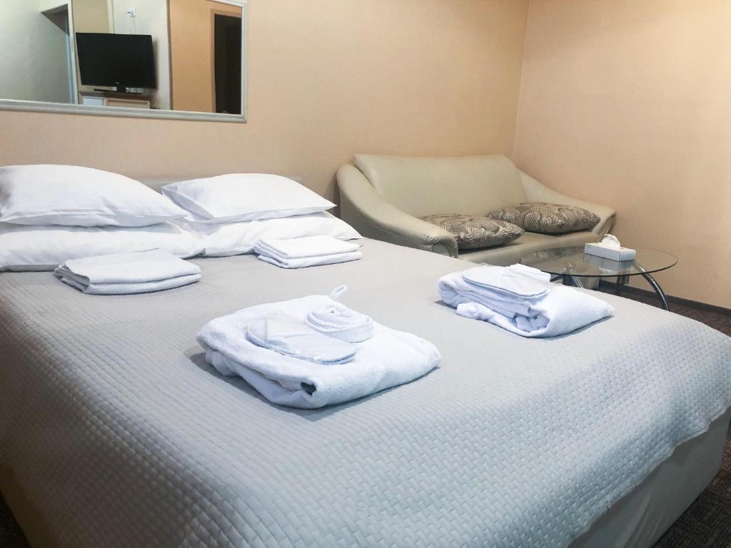 Postel nebo postele na pokoji v ubytování Hotel Yes