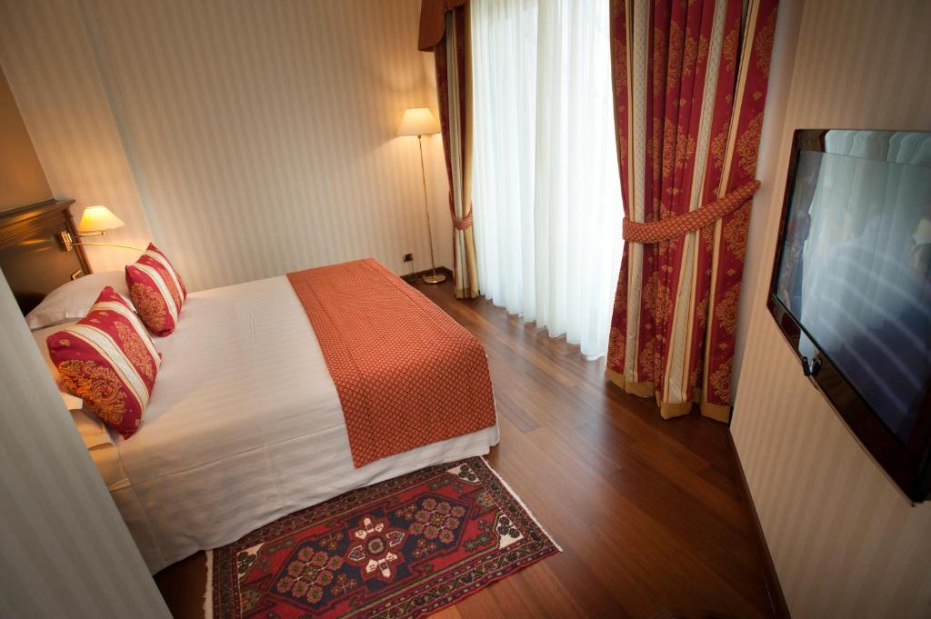 TV a/nebo společenská místnost v ubytování Hotel Calissano
