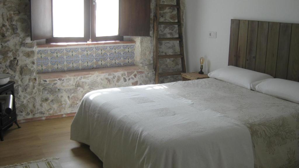 Posteľ alebo postele v izbe v ubytovaní Alojamiento de Piedra con Encanto