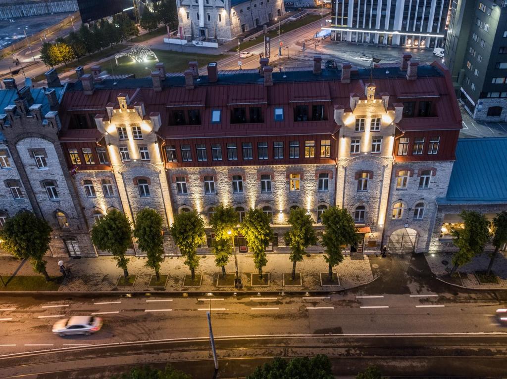 an old building in a city at night at Old Tallinn Apartments in Tallinn