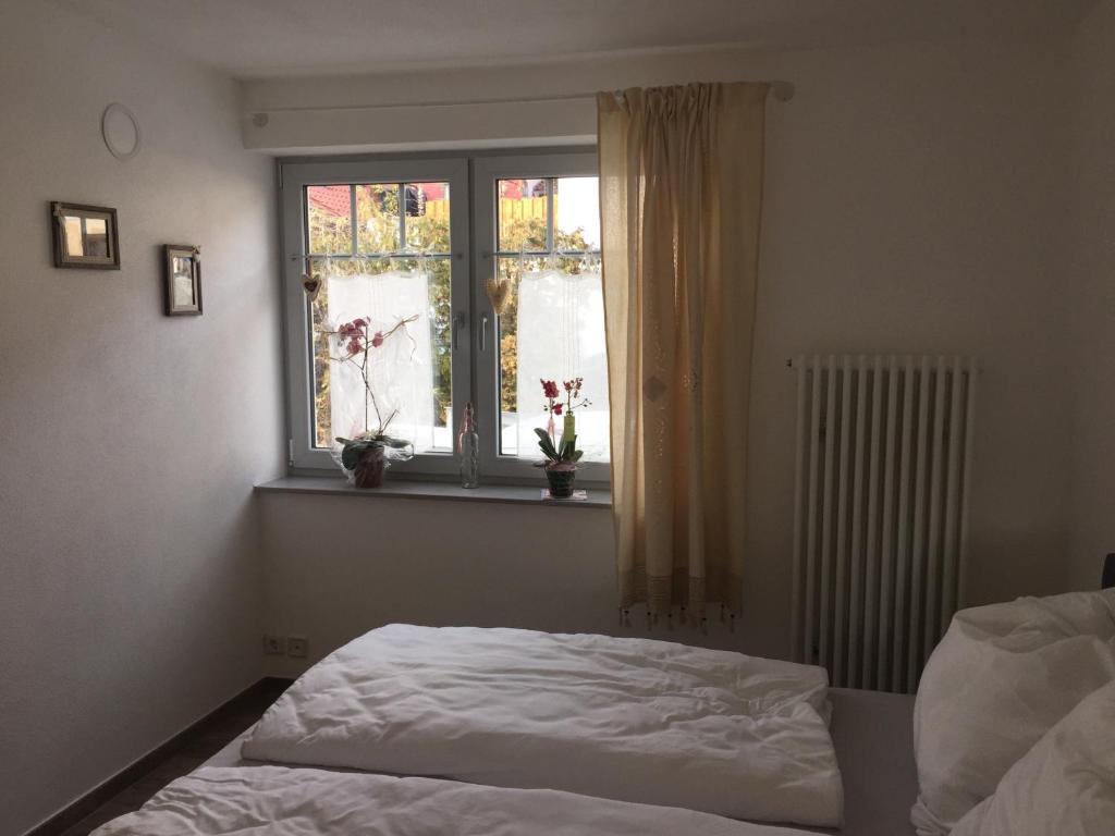 Postel nebo postele na pokoji v ubytování Ferienhaus unterm Schiefen Turm