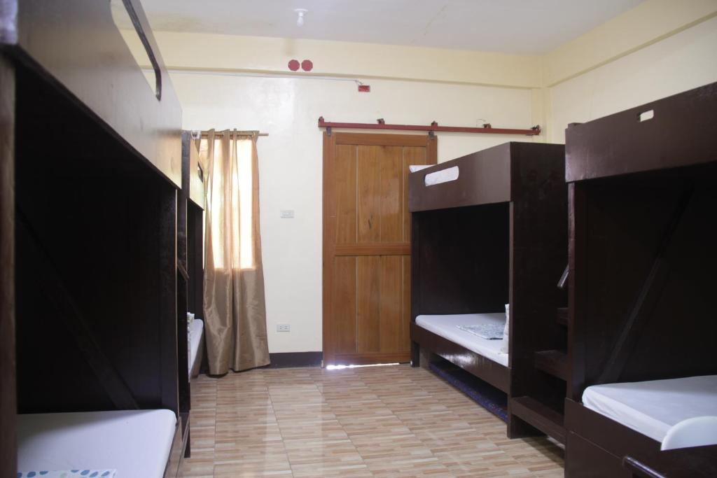Postel nebo postele na pokoji v ubytování Oasis Resthouse