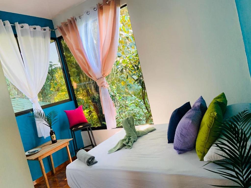 Postel nebo postele na pokoji v ubytování Guest House Pura Vida