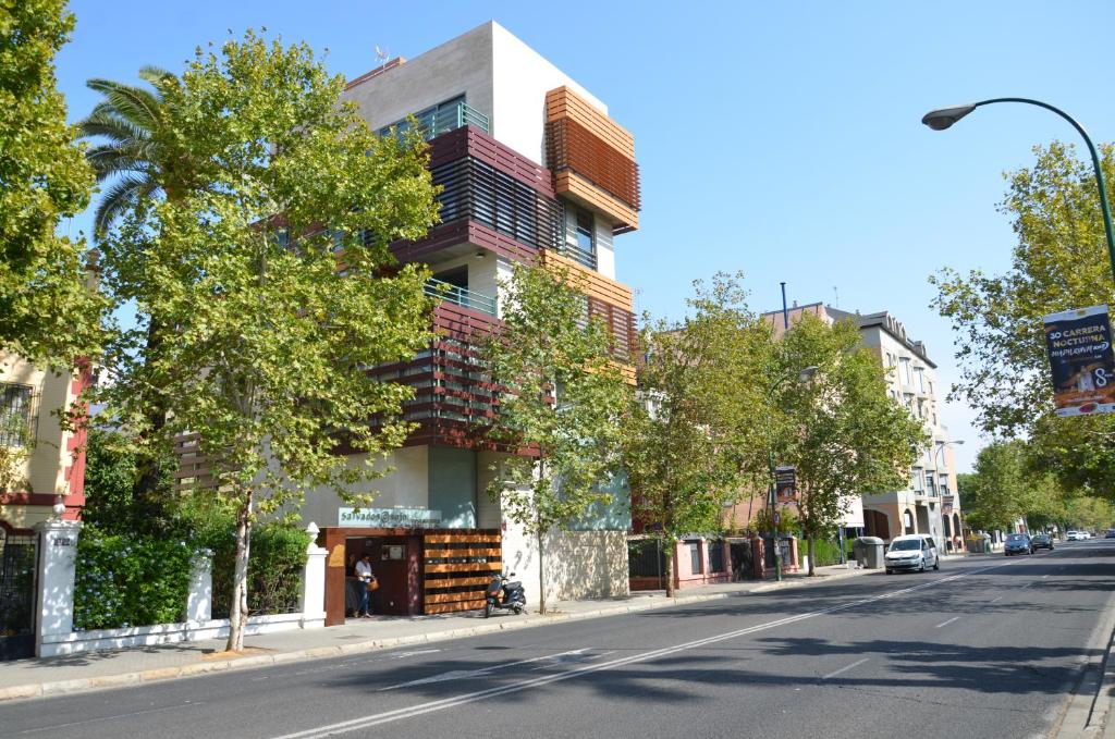 a building on the side of a city street at Urban House Siurot 33 in Seville